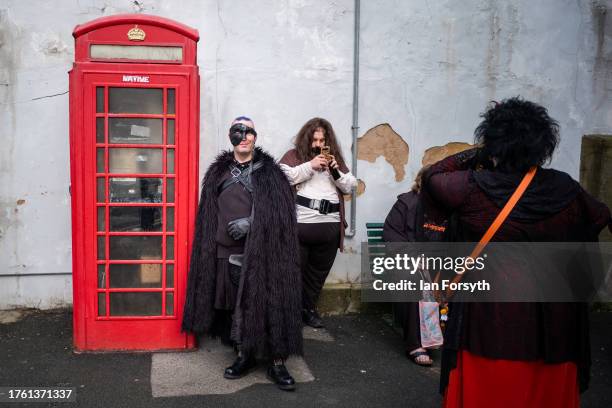 Visitors wearing costumes attend Whitby Goth Weekend on October 28, 2023 in Whitby, England. The Whitby Goth Weekend is an alternative festival which...