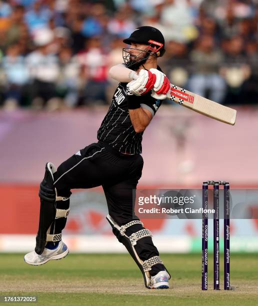 Daryl Mitchell of New Zealand bats during the ICC Men's Cricket World Cup India 2023 Group Stage Match between Australia and New Zealand at HPCA...