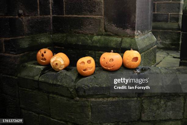 Pumpkins are placed on a wall during Whitby Goth Weekend on October 28, 2023 in Whitby, England. The Whitby Goth Weekend is an alternative festival...