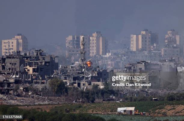 Image is a frame taken from a Video Clip) A missile strikes behind a minaret in Gaza on October 28, 2023 seen from Sderot, Israel. In the wake of the...