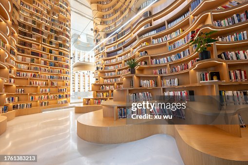 Wooden 3D bookcases in the library filled with books Wooden 3D bookcases in the library filled with books
