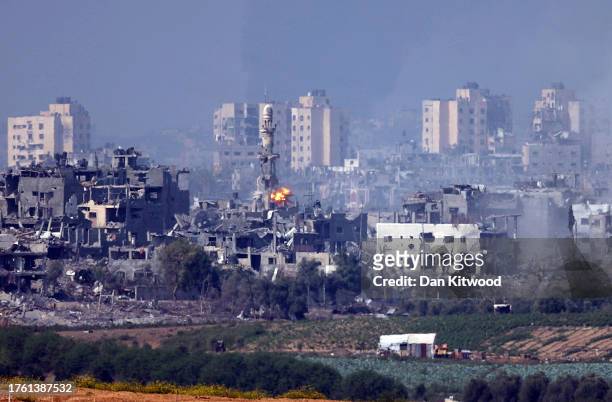 Image is a frame taken from a Video Clip) A missile strikes behind a minaret in Gaza on October 28, 2023 seen from Sderot, Israel. In the wake of the...