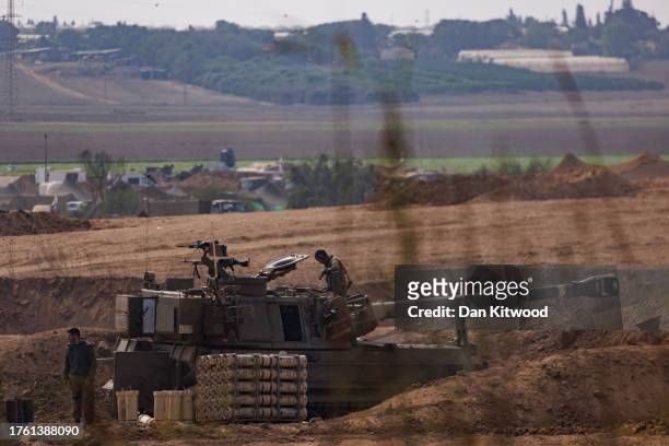 Israeli tanks and troops near the border with Gaza on October 28, 2023 in Sderot, Israel. In the wake of the Oct. 7 attacks by Hamas that left an...