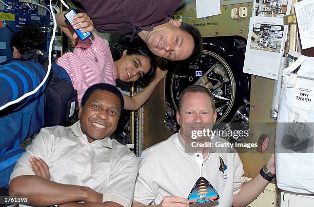 Four astronauts from the crew of the Space Shuttle Columbia mission STS-107; Mission Specialist David M. Brown, Payload Commander Michael P....