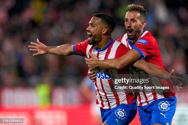 Cristian Stuani and Yangel Herrera of Girona FC celebrating their team's first goal during the LaLiga EA Sports match between Girona FC and Real Club...