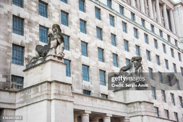 statues by the entrance of ministry of defence main building, london - department of defense stock pictures, royalty-free photos & images