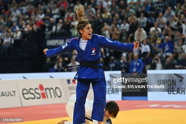 France's Shirine Boukli celebrates after her victory against Portugal's Catarina Costa in the women's under 48kg final bout during the European Judo...