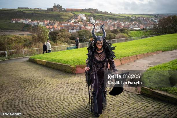 Woman in gothic themed clothing attends Whitby Goth Weekend on October 28, 2023 in Whitby, England. The Whitby Goth Weekend is an alternative...