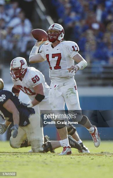 Quarterback Philip Rivers of the North Carolina State University Wolfpack throws a pass against the Notre Dame Fighting Irish in the Toyota Gator...