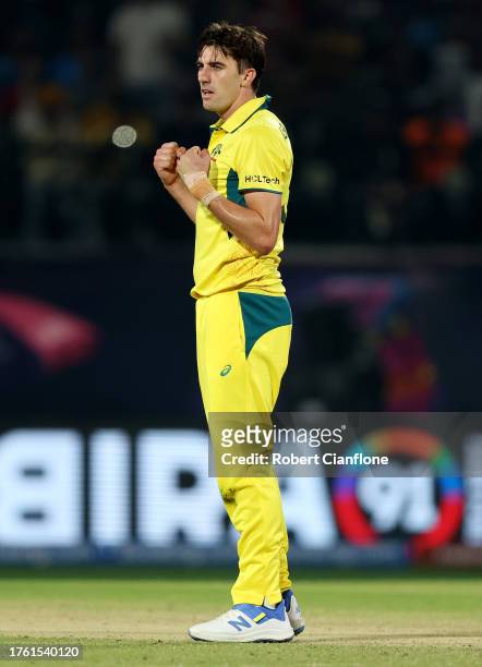 Pat Cummins of Australia celebrates after taking the wicket of Matt Henry of New Zealand during the ICC Men's Cricket World Cup India 2023 Group...