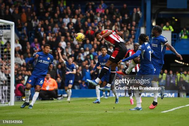 Ethan Pinnock of Brentford scores the team's first goal during the Premier League match between Chelsea FC and Brentford FC at Stamford Bridge on...