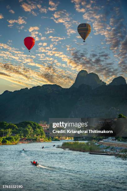 landscape view in evening at vang vieng, lao pdr. - vang vieng stockfoto's en -beelden