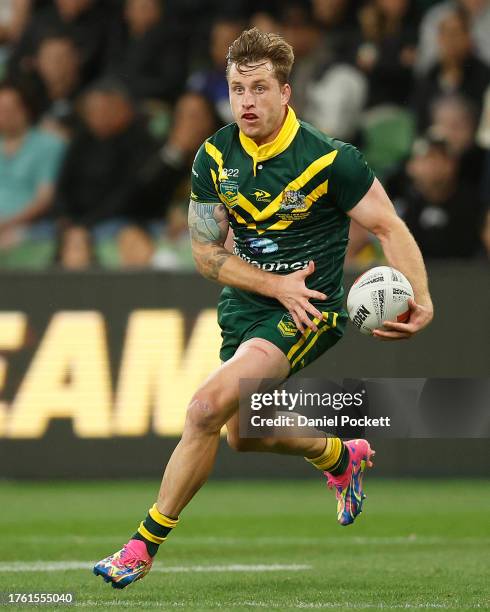 Cameron Munster of Australia runs with the ball during the Men's pacific Championship match between Australia Kangaroos and New Zealand Kiwis at AAMI...