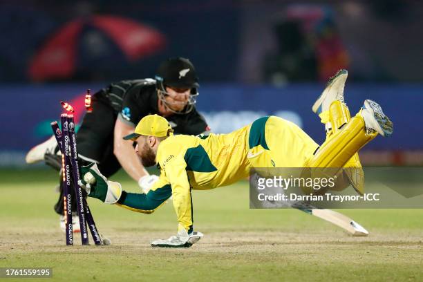 Jimmy Neesham of New Zealand is run out by Wicketkeeper Josh Inglis of Australia during the ICC Men's Cricket World Cup India 2023 Group Stage Match...