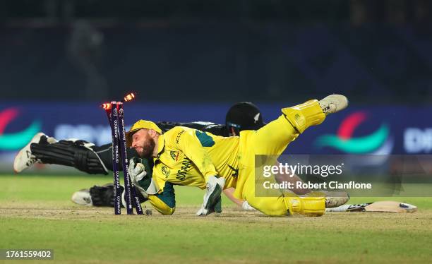 Jimmy Neesham of New Zealand is run out by Wicketkeeper Josh Inglis of Australia during the ICC Men's Cricket World Cup India 2023 Group Stage Match...