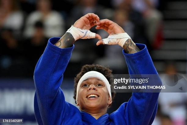 France's Amandine Buchard celebrates after her victory against Kosovo's Distria Krasniqi in the women's under 52kg final bout during the European...