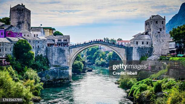stari most old bridge over the neretva river with the halebija tower  and kula tara - mostar bosnia and herzegovina - mostar stock pictures, royalty-free photos & images