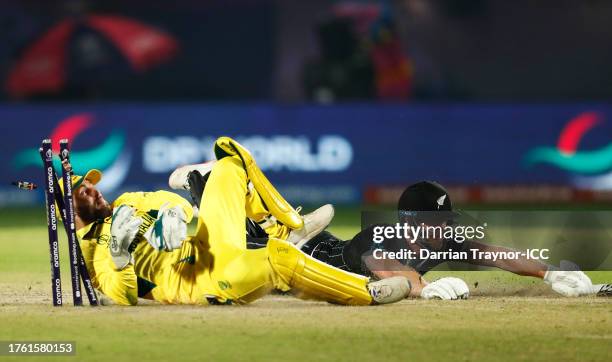 Jimmy Neesham of New Zealand is run out by Wicketkeeper Marnus Labuschagne of Australia during the ICC Men's Cricket World Cup India 2023 Group Stage...