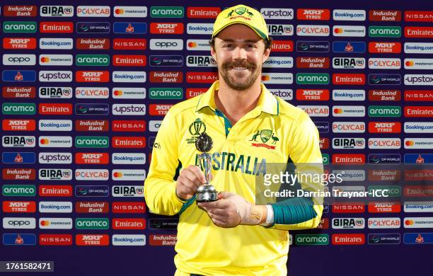 Travis Head of Australia poses for a photograph with the Man of the Match award after the ICC Men's Cricket World Cup India 2023 Group Stage Match...