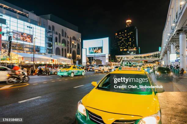 street of  bangkok at night. blurred motion of traffic - south korea v japan stock pictures, royalty-free photos & images