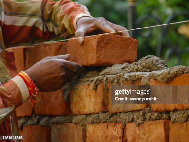 home renovation brick construction material concept - rohbau haus stock-fotos und bilder