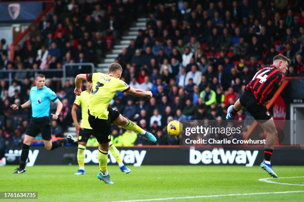 Charlie Taylor of Burnley scores the team's first goal past Alex Scott of AFC Bournemouth during the Premier League match between AFC Bournemouth and...