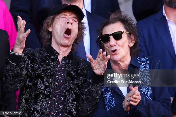 Members of the English rock band The Rolling Stones, Mick Jagger and Ronnie Wood, attend during the LaLiga EA Sports match between FC Barcelona and...