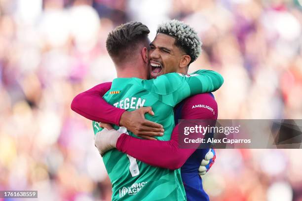 Marc-Andre ter Stegen and Ronald Araujo of FC Barcelona celebrate as Ilkay Guendogan of FC Barcelona scores the team's first goal during the LaLiga...