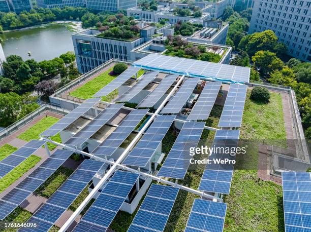 green roof with solar panels - green roof stock pictures, royalty-free photos & images