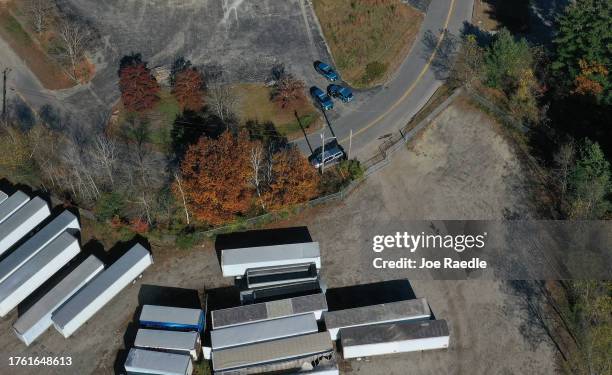In an aerial view, law enforcement officials are seen in the area near the Maine Recycling Center building where Robert Card, the suspect in two mass...