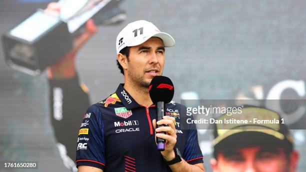 Sergio Perez of Mexico and Oracle Red Bull Racing talks to the crowd on the fan stage prior to final practice ahead of the F1 Grand Prix of Mexico at...