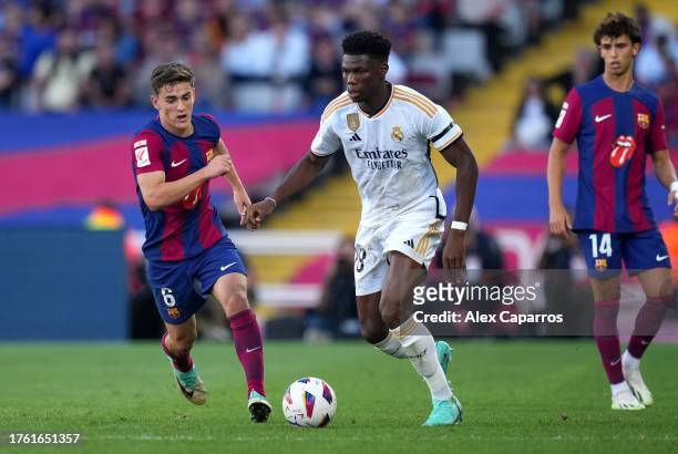 Aurelien Tchouameni of Real Madrid on the ball whilst under pressure from Gavi of FC Barcelona during the LaLiga EA Sports match between FC Barcelona...