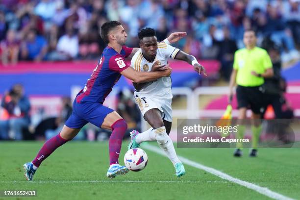 Vinicius Junior of Real Madrid and Ferran Torres of FC Barcelona battle for the ball during the LaLiga EA Sports match between FC Barcelona and Real...