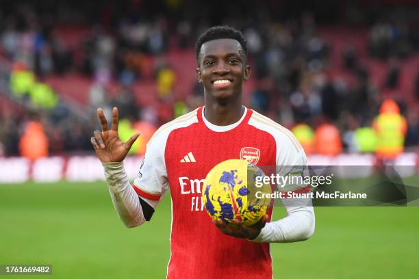 Eddie Nketiah of Arsenal poses for a photo with the match ball at full-time having scored a hat-trick in the Premier League match between Arsenal FC...