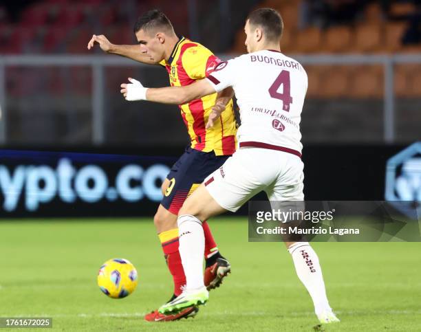 Nikola Krstovic of Lecce competes for the ball with Alessandro Buongiorno of Torino during the Serie A TIM match between US Lecce and Torino FC at...