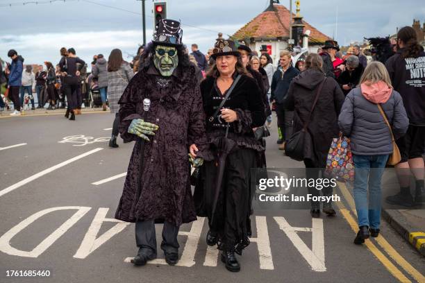 Couple attend Whitby Goth Weekend on October 28, 2023 in Whitby, England. The Whitby Goth Weekend is an alternative festival which also features the...