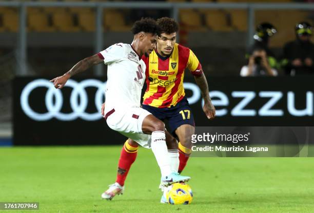 Valentin Gendrey of Lecce competes for the ball with Valentino Lazaro of Torino during the Serie A TIM match between US Lecce and Torino FC at Stadio...