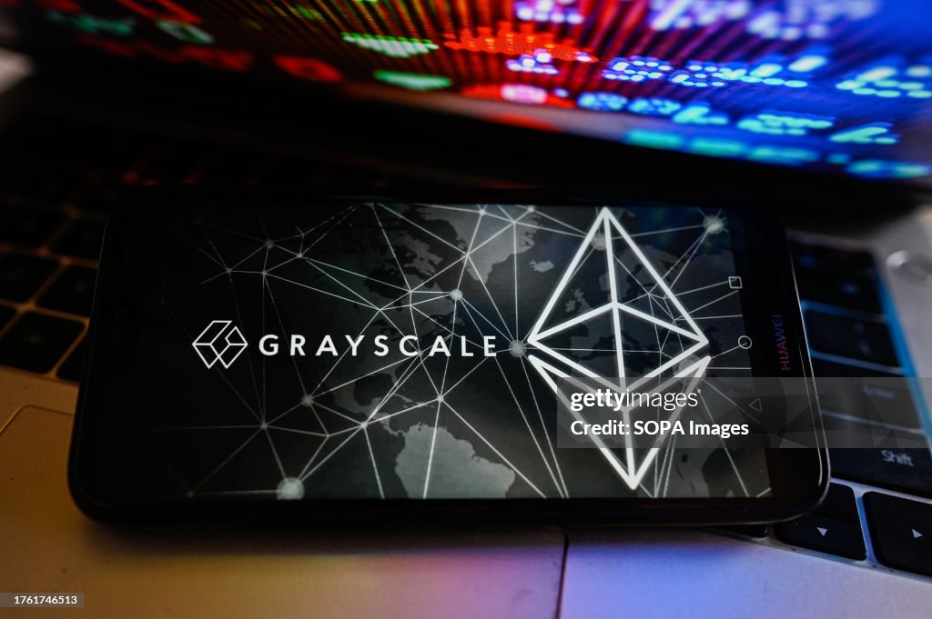In this photo illustration, a GrayScale logo is displayed on...