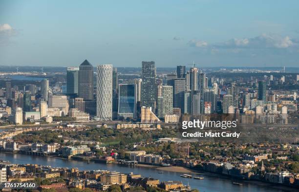 The high rise buildings of Canary Wharf in East London are seen overlooking the River Thames on October 24, 2023 in London, England. Built on the...