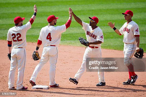 Jason Kipnis Mike Aviles Michael Bourn and Michael Brantley of the Cleveland Indians celebrate after defeating the Los Angeles Angels of Anaheim at...
