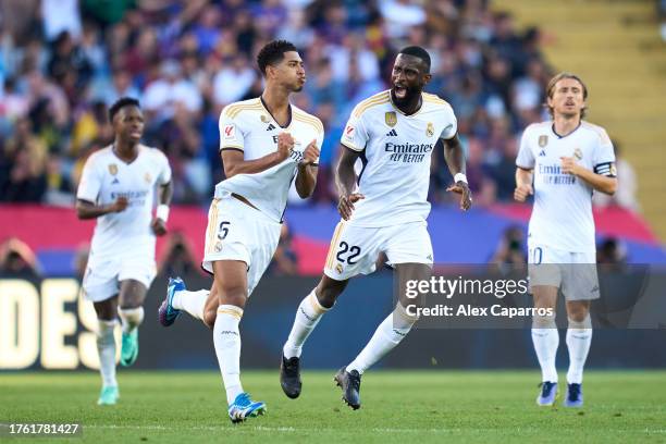Jude Bellingham of Real Madrid CF celebrates with his teammate Antonio Rudiger after scoring the team's first goal during the LaLiga EA Sports match...