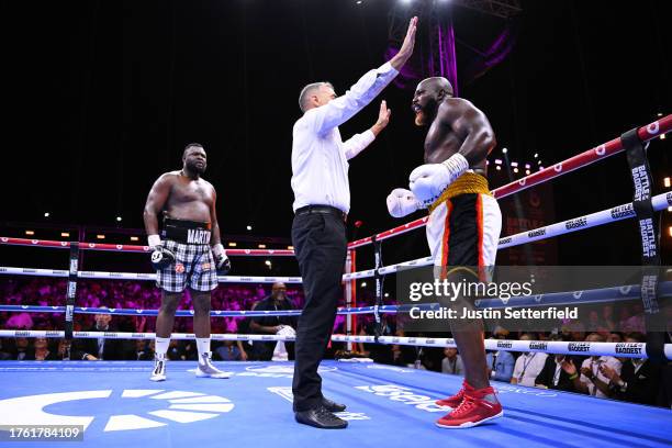 Referee Lee Every counts out Carlos Takam as Martin Bakole looks on during the Heavyweight fight between Martin Bakole and Carlos Takam at Boulevard...