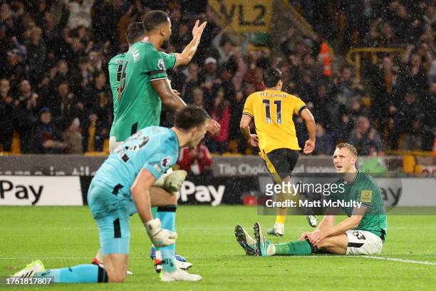 Dan Burn of Newcastle United looks dejected after Hwang Hee-Chan of Wolverhampton Wanderers scores the teams second goal during the Premier League...