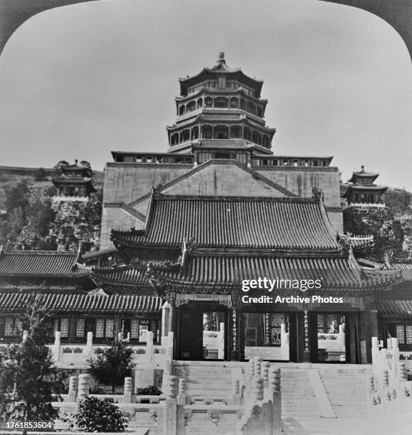 Low-angle view of the Foxiang Ge on Wanshou Shan in the grounds of the Summer Palace, a Qing dynasty imperial garden in Beijing, China, circa 1901....