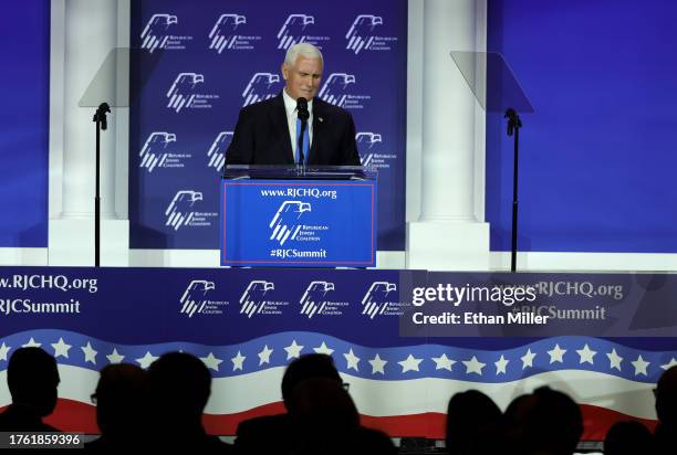 Republican presidential candidate former U.S. Vice President Mike Pence reacts after suspending his campaign for president during the Republican...