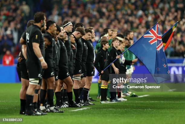 Players of New Zealand line up for the national anthems prior to the Rugby World Cup Final match between New Zealand and South Africa at Stade de...