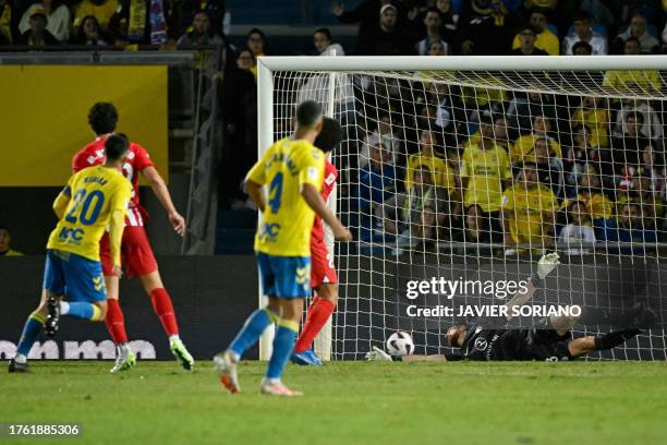 Las Palmas' Spanish midfielder Kirian Rodriguez scores the opening goal during the Spanish league football match between UD Las Palmas and Club...