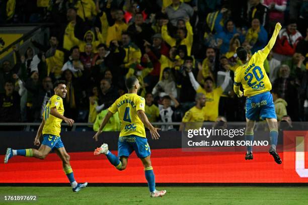 Las Palmas' Spanish midfielder Kirian Rodríguez celebrates scoring the opening goal during the Spanish league football match between UD Las Palmas...