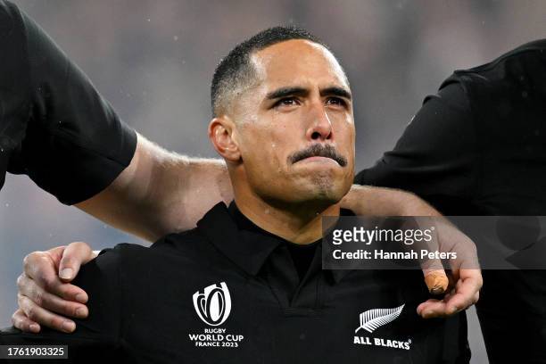 Aaron Smith of New Zealand reacts as the team sing their national anthem prior to the Rugby World Cup Final match between New Zealand and South...