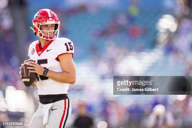 Carson Beck of the Georgia Bulldogs warms up before the start of a game against the Florida Gators at EverBank Stadium on October 28, 2023 in...